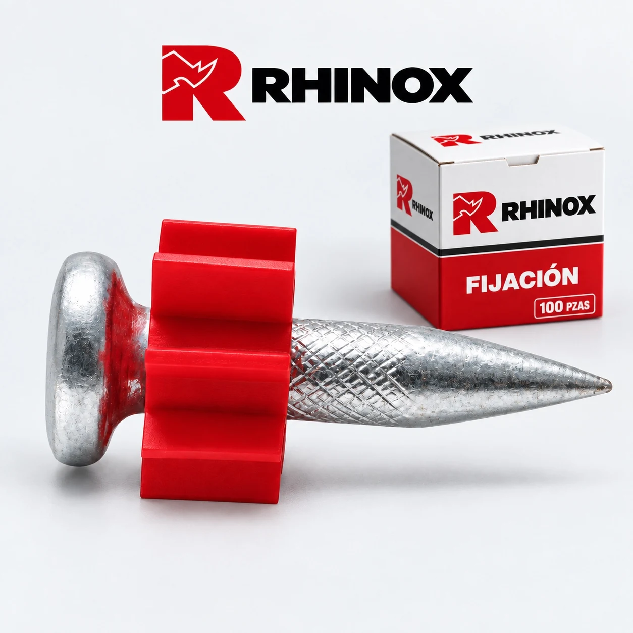 Clavo de fijación plateado corto con camisa roja, junto a caja RHINOX de 100 piezas